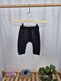 Černé tepláky H&M 68
