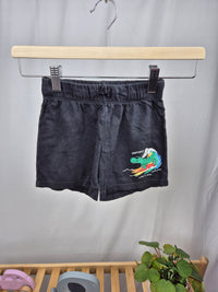 Černé kraťasy s dinosaurem H&M 104